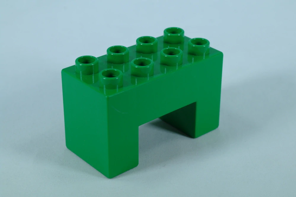LEGO® DUPLO® kostka/cihla 2x4x2 s výřezem 2x2 - zelená