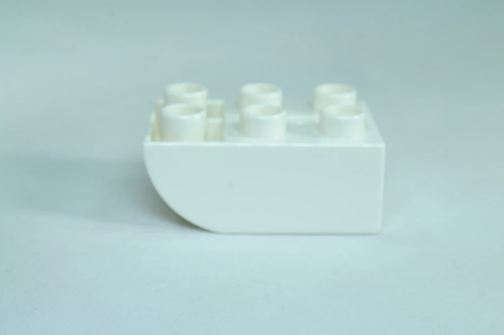 LEGO® DUPLO® cihla 2x3 se zakřivenou spodní částí