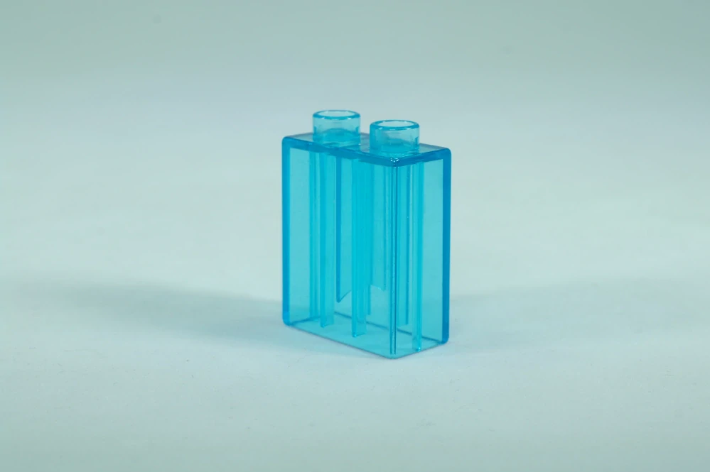 LEGO® DUPLO® kostka/cihla 1x2x2 trans. sv. modrá