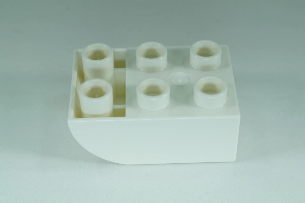 LEGO® DUPLO® cihla 2x3 se zakřivenou spodní částí