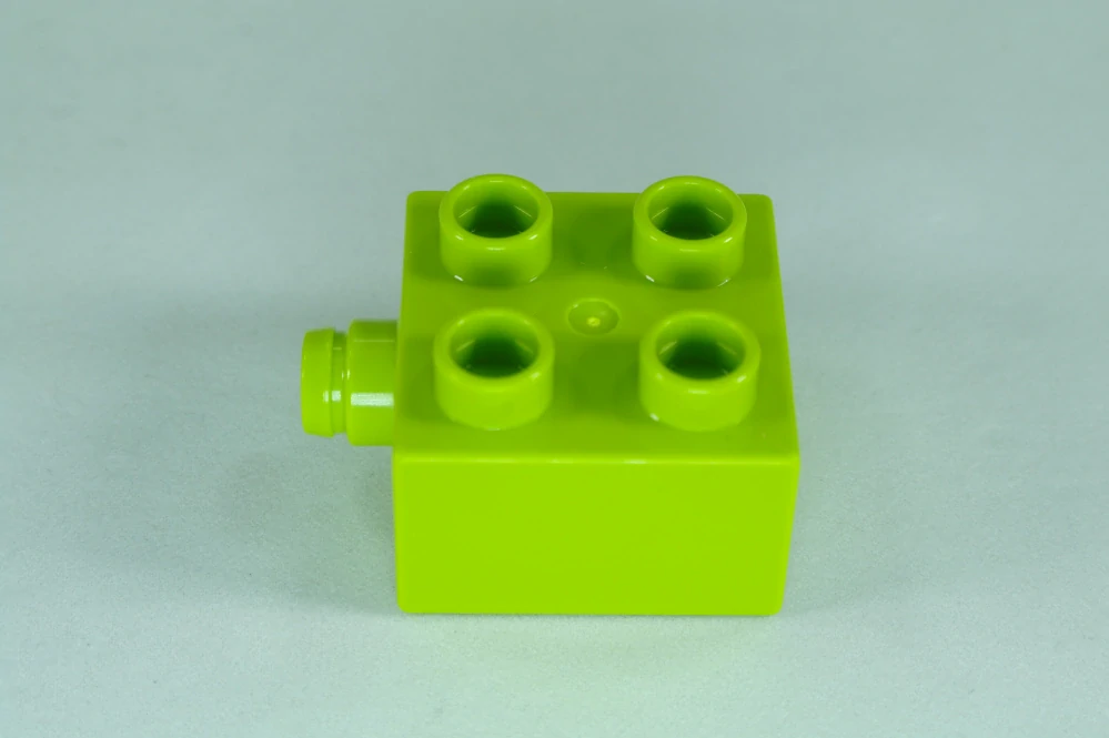 LEGO® DUPLO® kostka/cihla 2x2 s čepem na boku - limetka