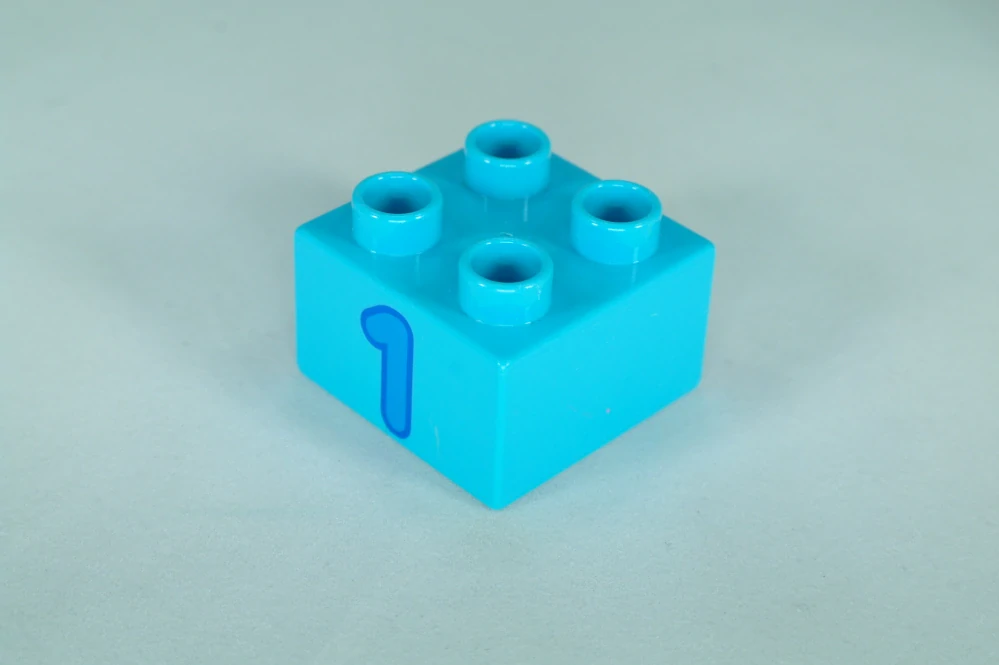 LEGO® DUPLO® cihla 2x2 s číslem 1, středně azurová