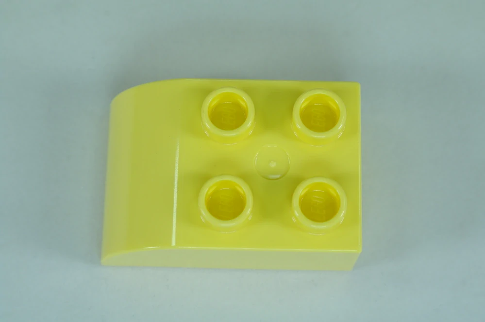 LEGO® DUPLO® cihla 2x3 se zakřivenou horní částí