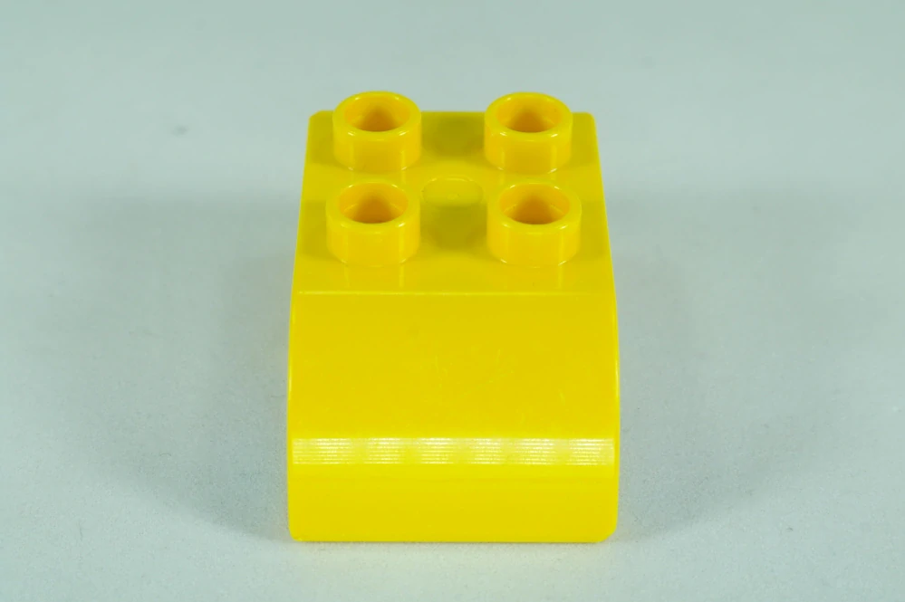 LEGO® DUPLO® cihla 2x3 se zakřivenou horní částí, vzor okna vozidel