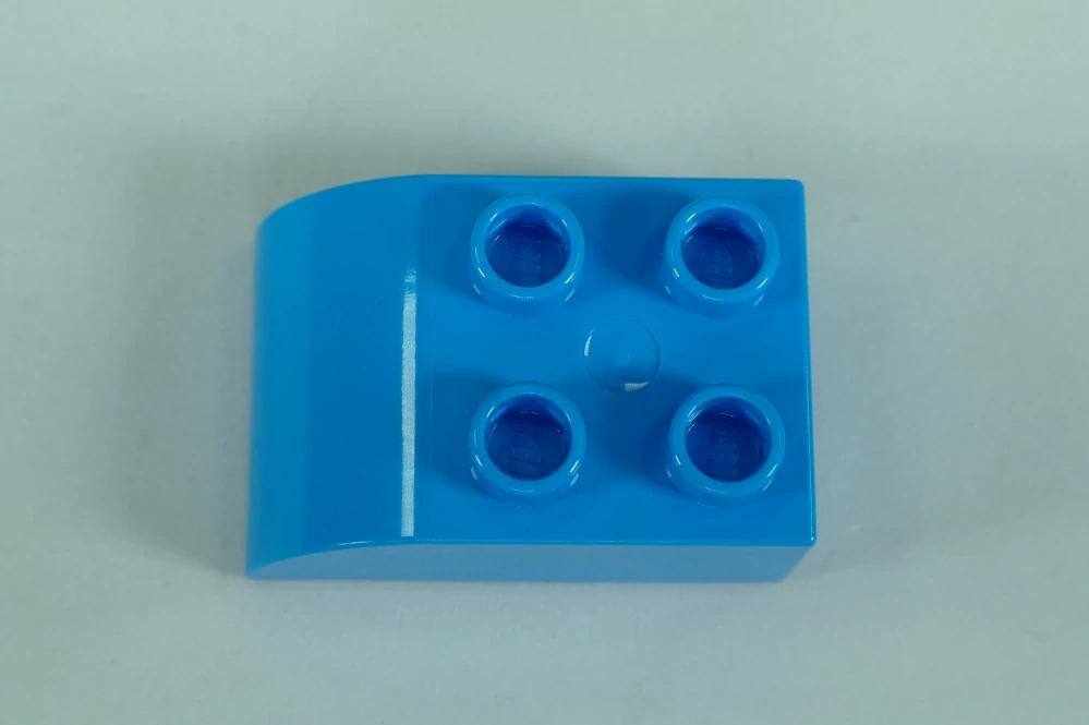 LEGO® DUPLO® cihla 2x3 se zakřivenou horní částí