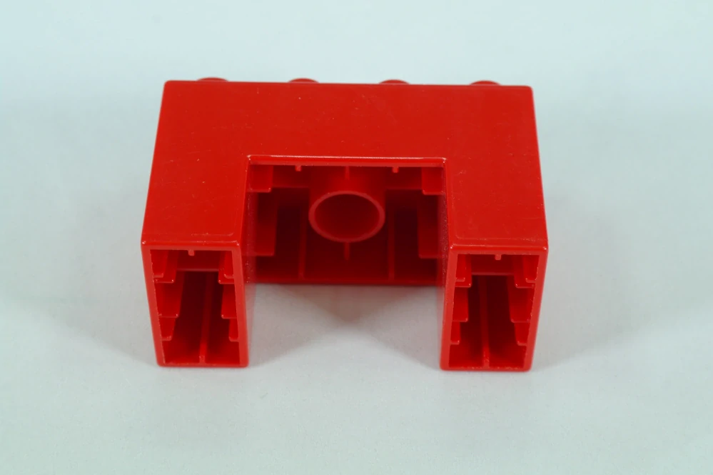 LEGO® DUPLO® kostka/cihla 2x4x2 s výřezem 2x2 - červená