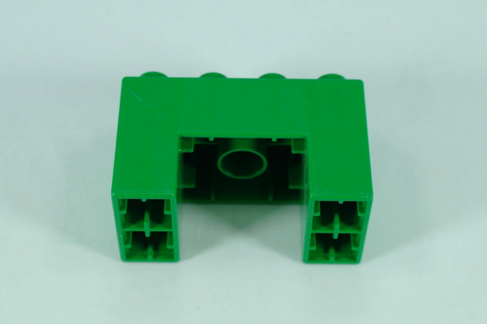 LEGO® DUPLO® kostka/cihla 2x4x2 s výřezem 2x2 - zelená