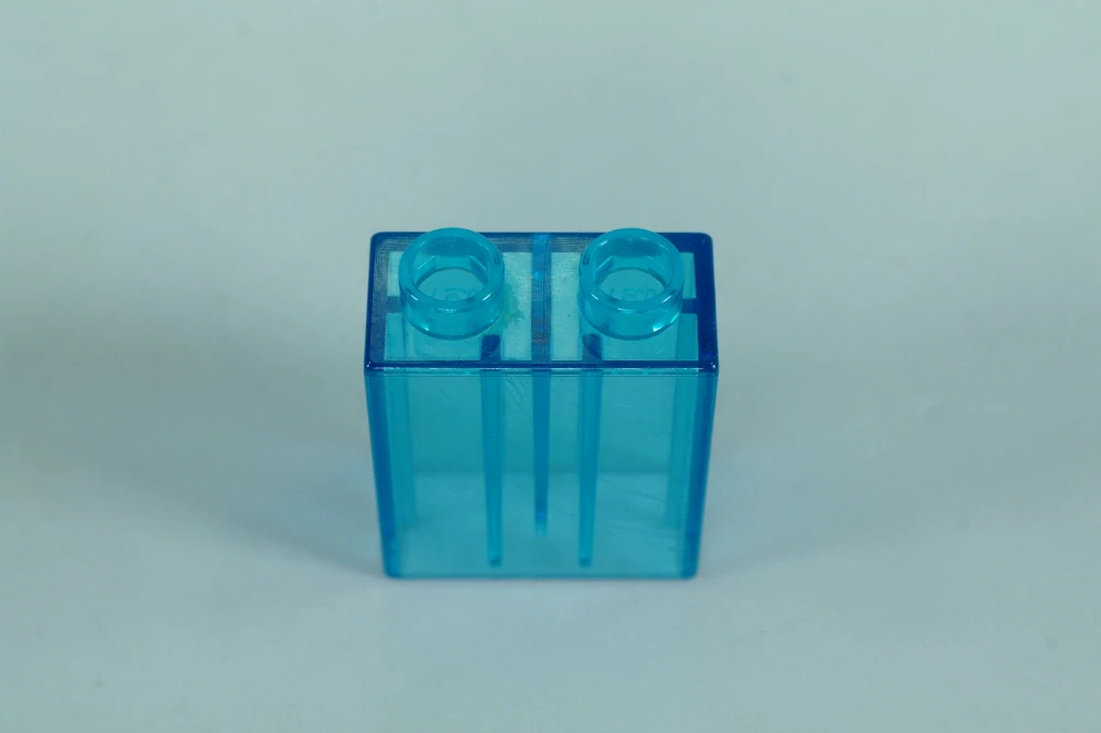 LEGO® DUPLO® kostka/cihla 1x2x2 trans. sv. modrá