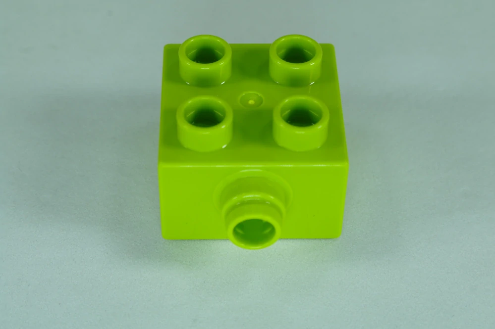 LEGO® DUPLO® kostka/cihla 2x2 s čepem na boku - limetka